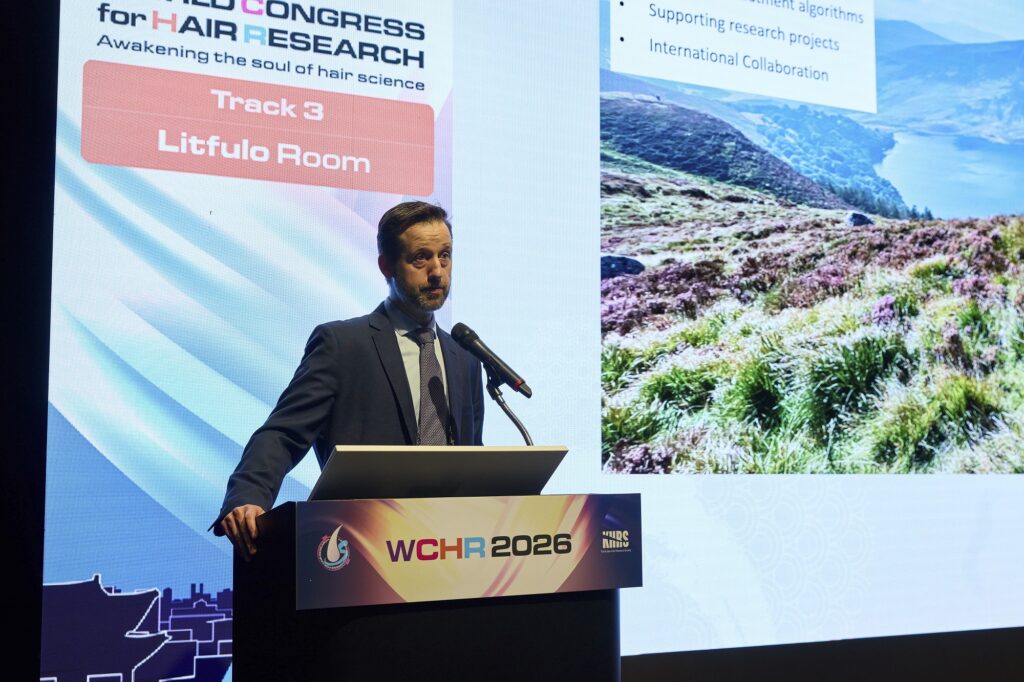 Dr Dmitri Wall presenting at WCHR2026